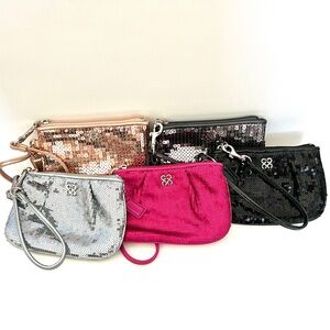COACH sequin wristlets